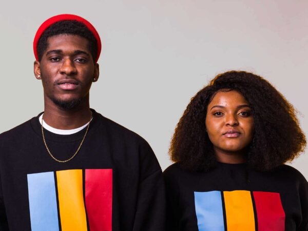 African American woman and man standing looking stringht forward